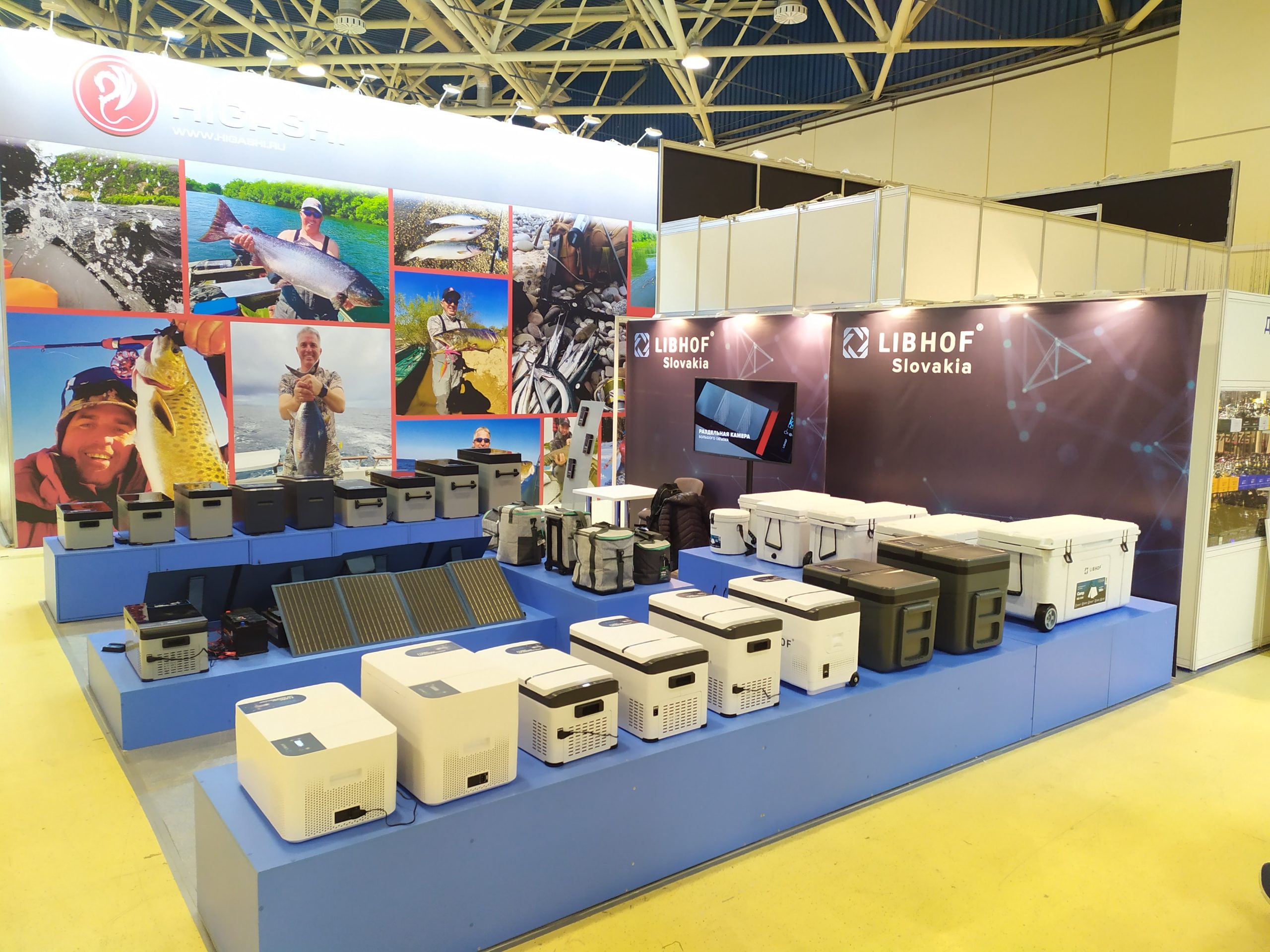 A row of portable car fridges on display.