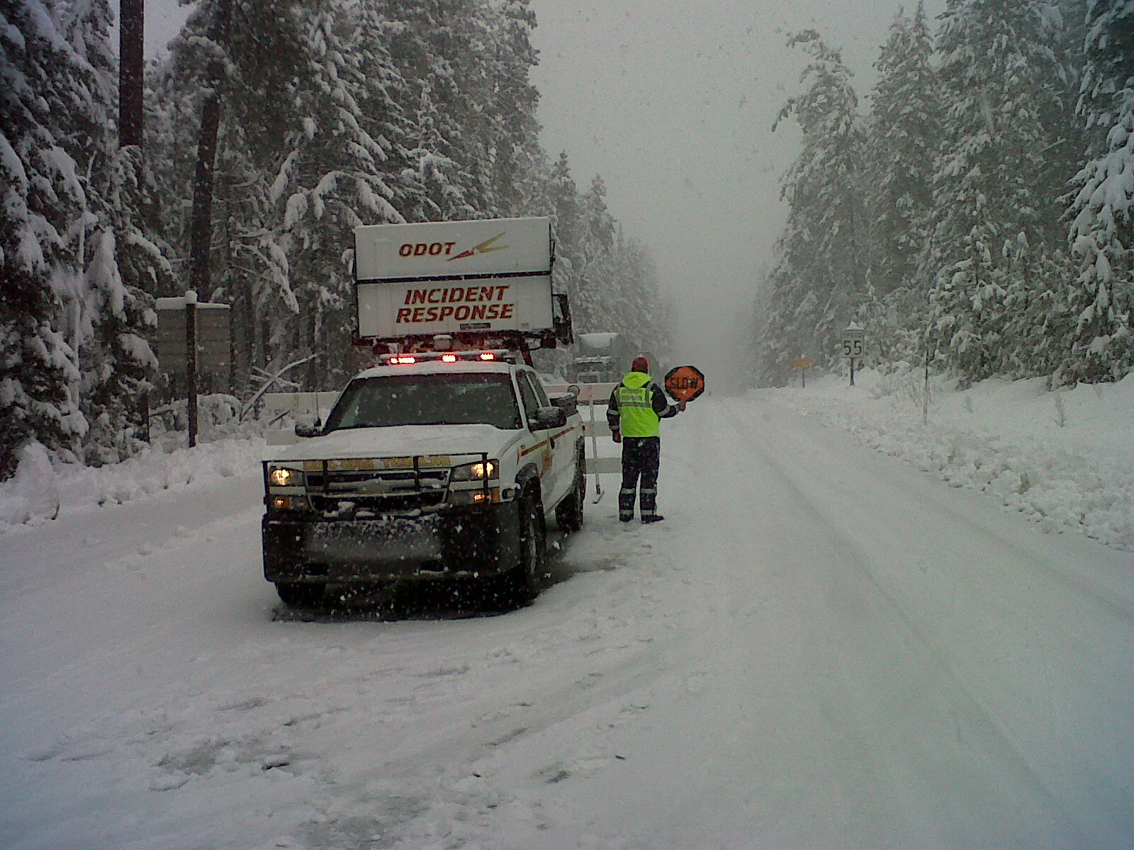 Snow-covered highway at a winter road closure.